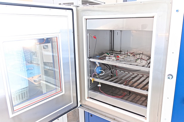 The inside of a climate chamber with an electrical test set up