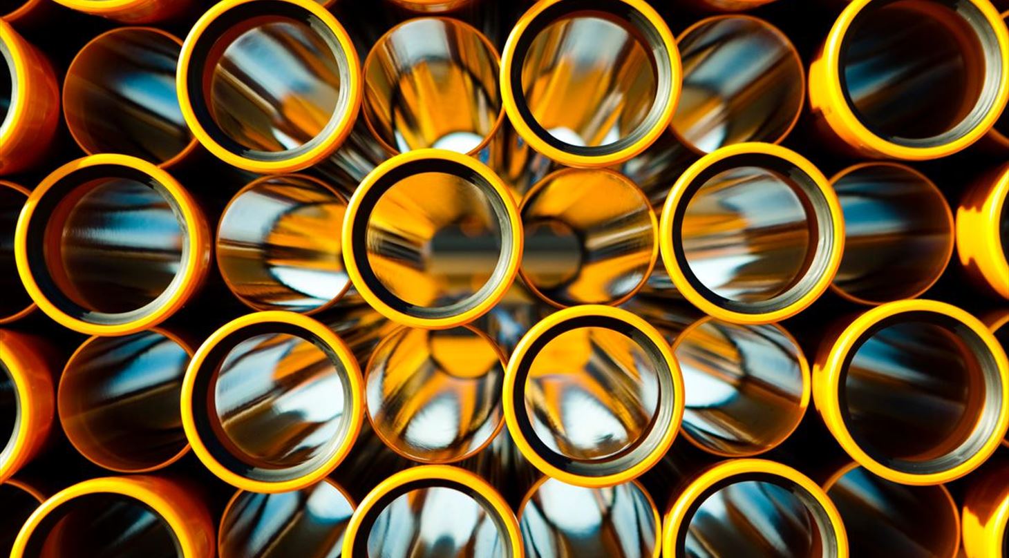 Stack of orange pipes - with the ends on display